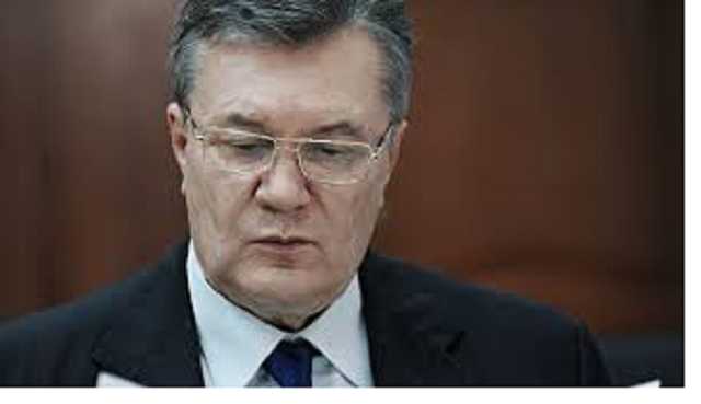 Рядом с Медведевым: Януковича засекли на матче Россия - Испания