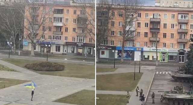 В Херсоне парень на центральной площади размахивал украинскими флагами перед танками