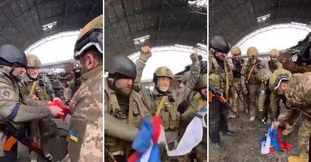 Грузинские добровольцы в Гостомеле у разбомбленной "Мрии" сожгли российский триколор