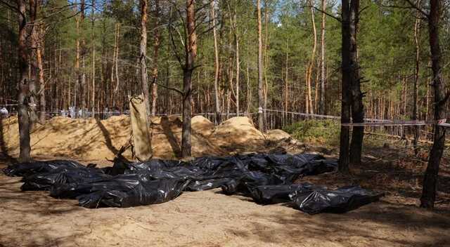 Появились новые фото с места массового захоронения в Изюме