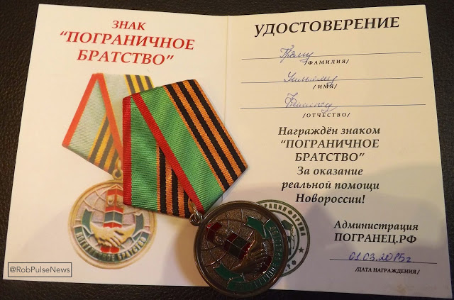 Graham Phillips’ actual award: a medal and certificate dated March 1st - a