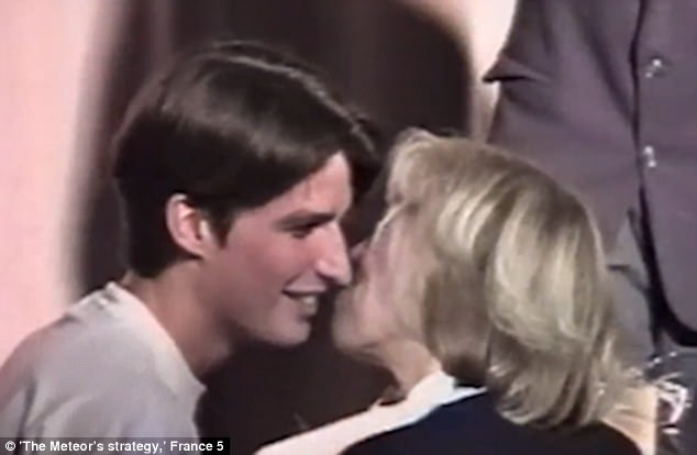 Footage captures the moment a 15-year-old Emmanuel Macron (left) kissed his 40-year-old teacher (right) - two years before he declared he wanted to marry her dqxikeidqxidqeant