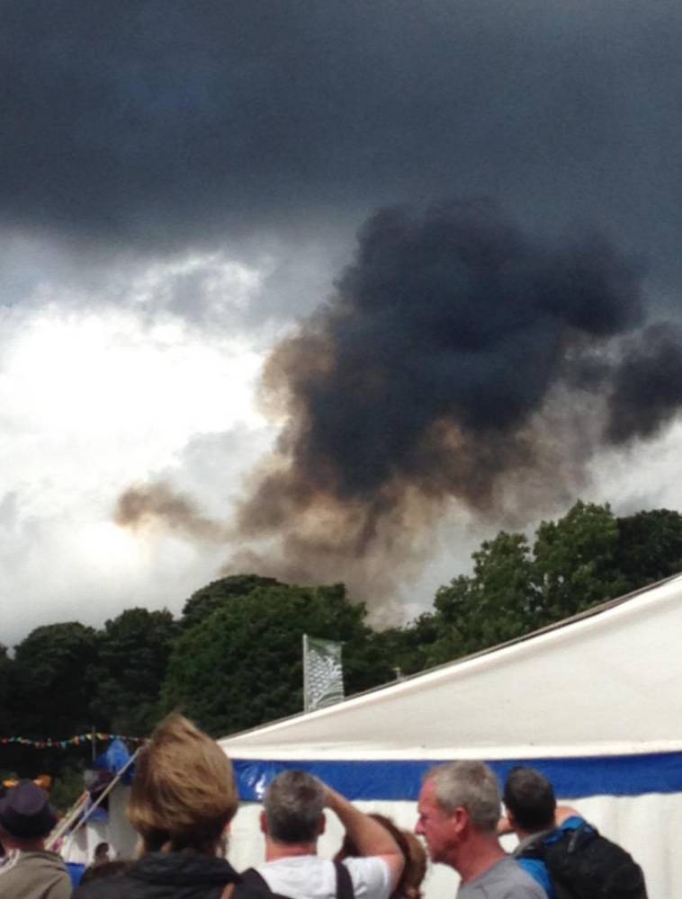 PIC FROM CATERS NEWS - A stunt plane has crashed during an aerobatics show at a car festival in Cheshire. There is currently no confirmation of any injuries or the type of plane involved, although it was reported to be of a similar design to those used by the Red Arrows. Police have confirmed that they are attending the incident. dqxikeidqxidqeant