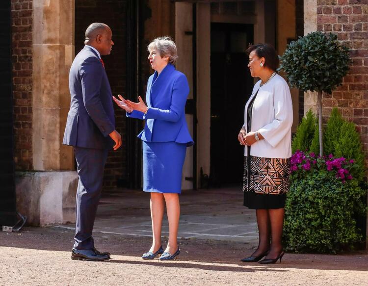 U.K. Prime Minister Teresa May and Commonwealth  General Patricia Scotland welcome Roosevelt Skerrit