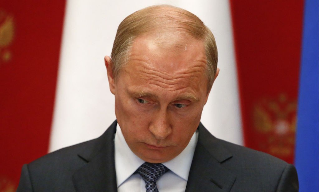 Russian President Vladimir Putin takes part in a news conference after meeting with Swiss Federal President Didier Burkhalter in the Kremlin in Moscow, Wednesday, May 7, 2014. (AP Photo/Sergei Karpukhin, Pool) dqxikeidqxidqeant