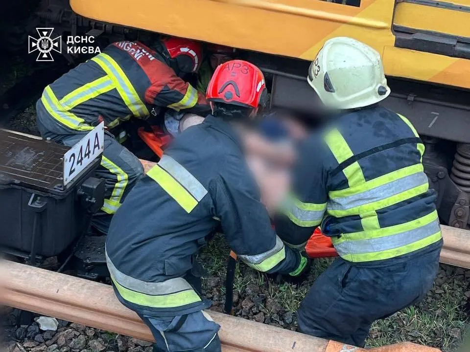 In Kyiv, rescuers retrieved a man from under a metro train carriage who had fallen onto the tracks. Details and photos